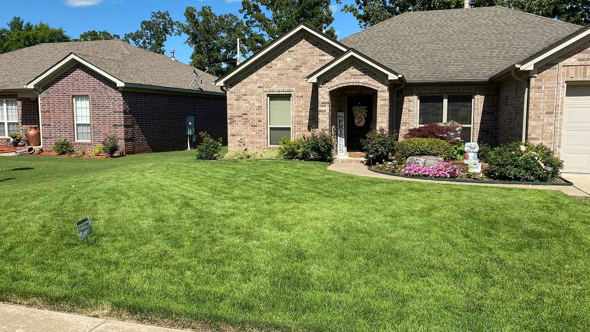 Healthy home lawn with regular lawn care in Benton, AR.
