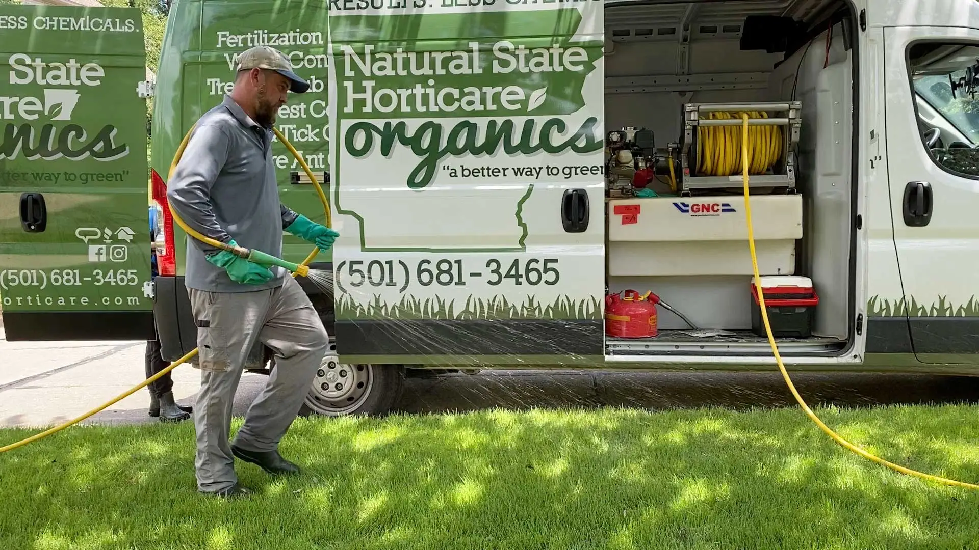 Natural State Horticare work truck and technician at a home in Little Rock, AR.