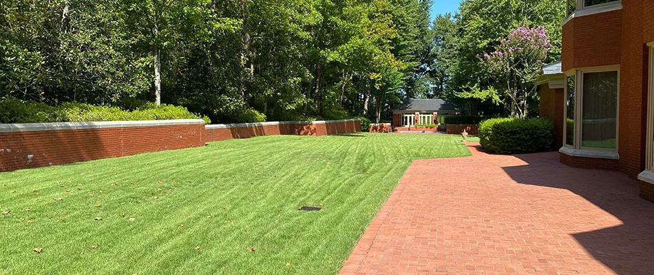 Lawn with regular lawn care services in Sherwood, AR.