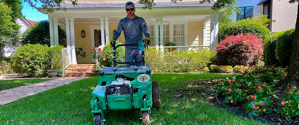 Professional lawn core aeration service at a home in Little Rock, AR.